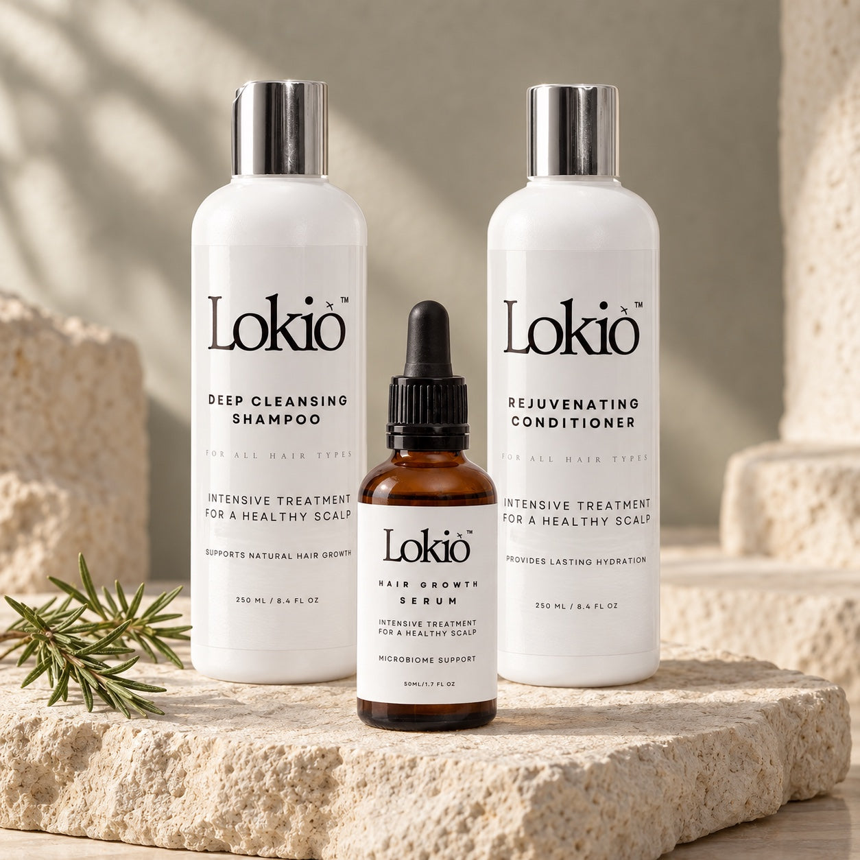 Lokio Deep Cleansing Shampoo, Rejuvenating Conditioner and Hair Growth Serum on warm limestone